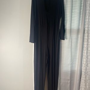 Black jumpsuit with white stripes on the side